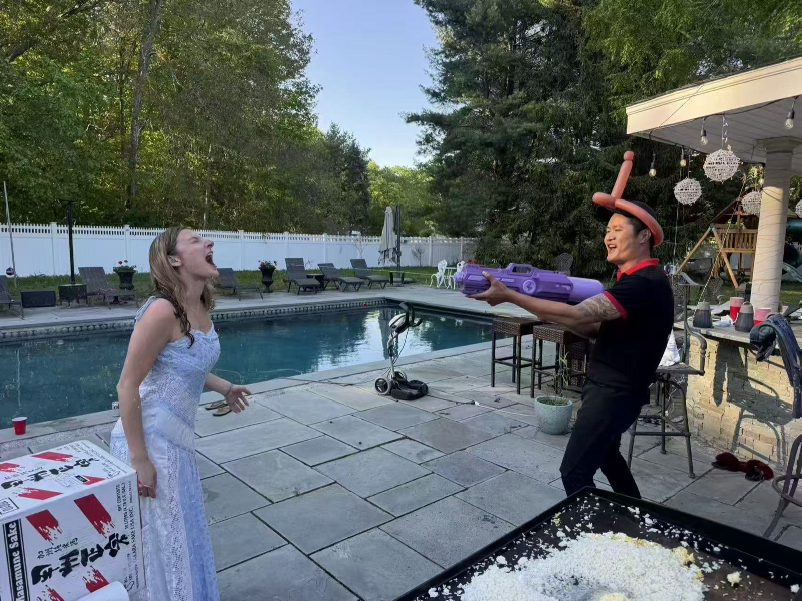 Poolside Party Guest catching food from hibachi chef at a poolside party in Connecticut